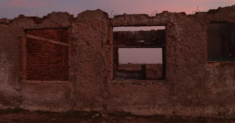 Walking through destructed city at dawn. Traveling through borken window. 스톡 동영상 126149537