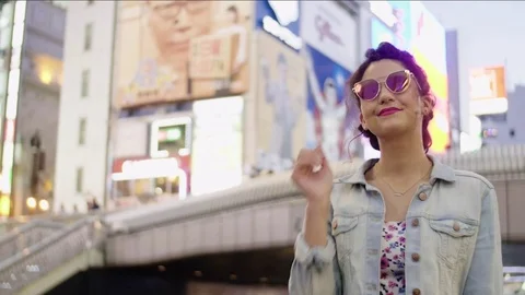 Walking through dotombori neon lights in Osaka Japan leading shot Vidéo 76487497