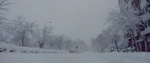Walking through an empty city during blizzard.Editorial Madrid. Spain.01/08/2021 Stock Footage 148392157