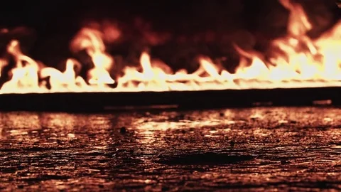 Walking through the fire in a army boots Stock Footage 77069263