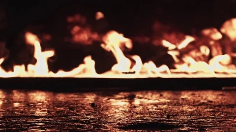 Walking through the fire in a army boots Stock Footage 77069279