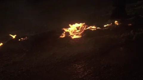Walking through fire in slow motion 動画素材 76801056