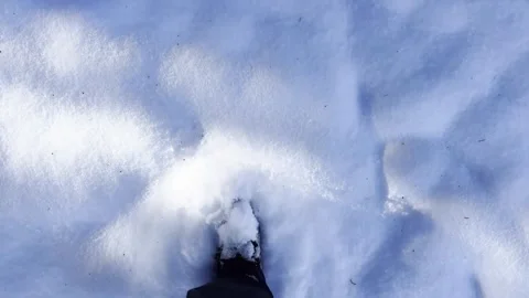 Walking through fresh snow, close-up of boots and footsteps Stock Footage 324761125