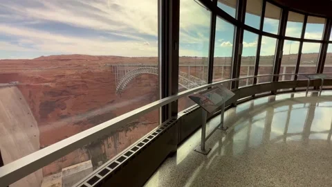 Walking through Glen Canyon Dam with bridge view 库存影片 254807346