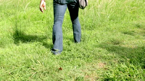 Walking through grass 스톡 동영상 55693559