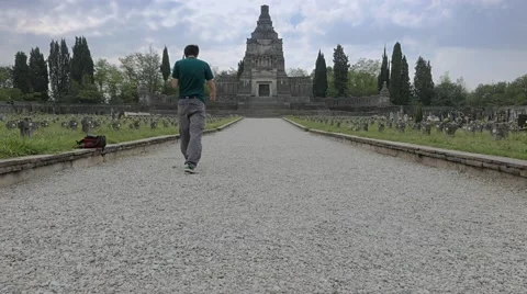 Walking through a graveyard with a huge mausoleum Stock Footage 54917657