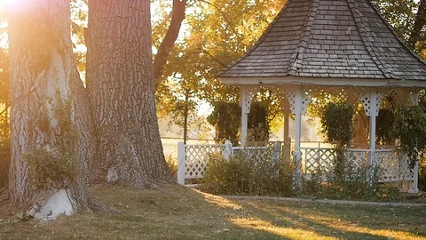 Walking through grounds with gazebo Stock Footage 102676295