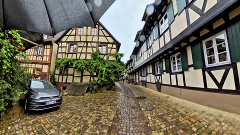 Walking Through Historic Half-Timbered Street With Car Video stock 344571034