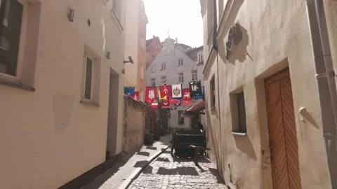 Walking Through Historic Riga Old Town Alley Toward Tourists And Cafes Stock Footage 342032409
