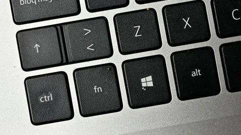 Walking through the keyboard of a laptop Stock Footage 220649431
