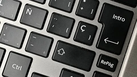 Walking through the keys of a laptop Stock Footage 220648891