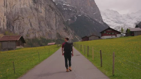 Walking Through Lush Fields in Lauterbrunne Stock Footage 287382854