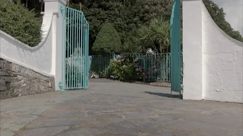Walking through mansion open gates Stock Footage 128498040