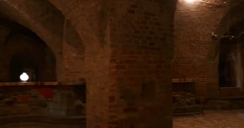 Walking through the medieval basement of Leśnica Castle, Poland Stock Footage 338396336