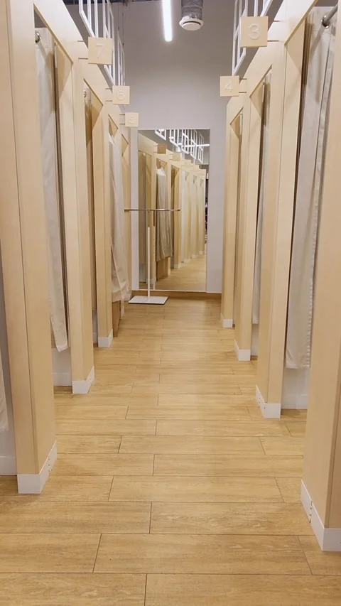 Walking through a modern store fitting room hallway Stock Footage 337203322