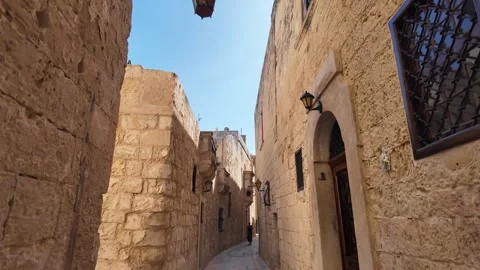 Walking through narrow cozy cobblestone alley in ancient city Vídeo Stock 317119360
