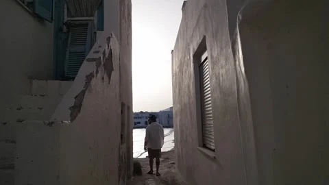 Walking through the narrow streets of the town of Naoussa in Paros Stock Footage 277863428