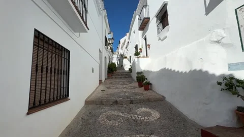 Walking through narrow streets in the white village of Frigiliana Spain Vidéo 267614020