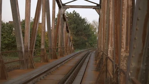 Walking through old arch railway bridge. POV shot on gimbal. Stock Footage 119543595