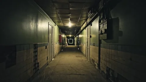Walking through Old dark apartment building, long dark hallway. Stockbeeldmateriaal 152243294