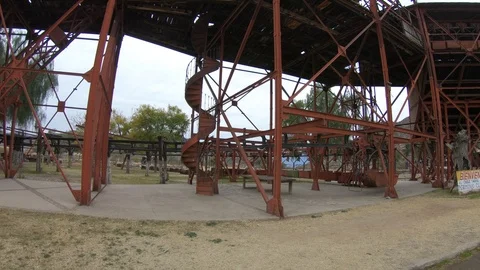 Walking through old iron structure towards spiral staircase 스톡 동영상 103406112