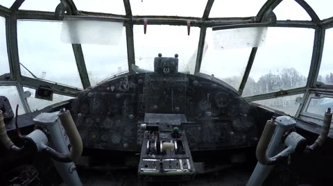 Walking through plane towards and old ancient cockpit showing windows 4k Stock Footage 60600829