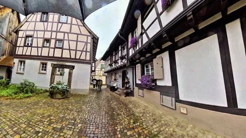 Walking Through Rainy Half-Timbered Old Town Street Video stock 344571021