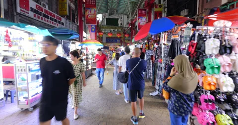 Walking through rather empty Petaling Street Market in Kuala Lumpur Stock Footage 319635971