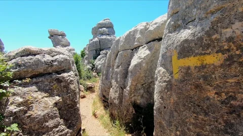 Walking through a rock corridor in El Torcal of Antequera Stock Footage 271066983