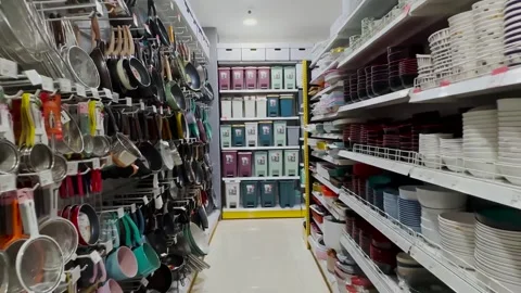 Walking through rows in a supermarket with a basket at grocery store. Stock Footage 250220561
