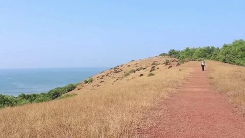 Walking through a sea side trek  Stock Footage 107473079
