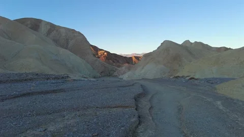 Walking Through the Shadowed Badlands Wash, Death Valley Stock Footage 330980146