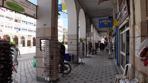 Walking through shopping street in modern Sfax, commerce economy Tunisia Stock Footage 334379986