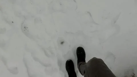 Walking through snow in winter looking down at feet  Stock Footage 275289311