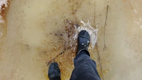 Walking through the spring flood Stock Footage 153578307