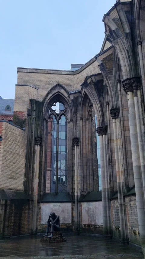 Walking through the St Nikolai memorial courtyard in Hamburg Germany Stockbeeldmateriaal 341266981