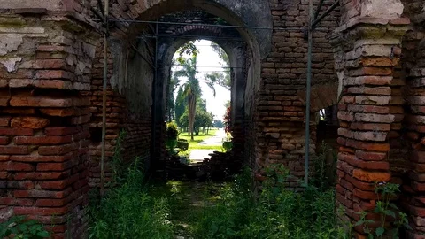 Walking through stone brick archway ruins of Misión Jesuitica, San José de 動画素材 101140181