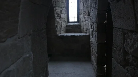 Walking through stone corridor in medieval Castle Stock Footage 128668837