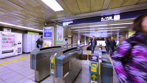 Walking through a ticket barrier in Toky... | Stock Video | Pond5