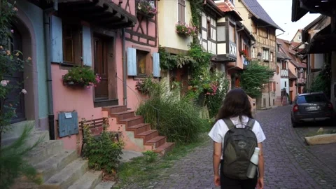 Walking through the tiny fairy streets of medieval french village Eguisheim. Stock Footage 145964625