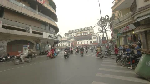 Walking through traffic in old quarter of Hanoi city, Vietnam on March 2016 Stock Footage 132087085