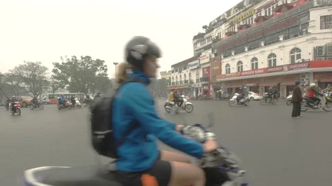 Walking through traffic in old quarter of Hanoi city, Vietnam on March 2016 Stock Footage 132087095