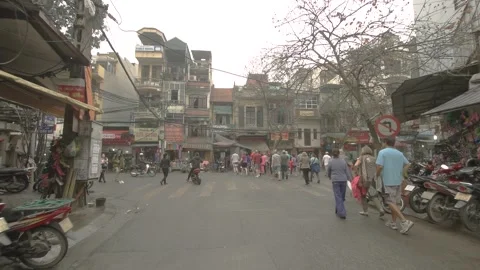 Walking through traffic in old quarter of Hanoi city, Vietnam on March 2016 Stock Footage 132087142
