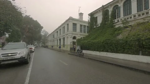 Walking through traffic in old quarter of Hanoi city, Vietnam on March 2016 Stock Footage 132087198