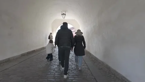 Walking through the vaulted stone gate tunnel of Kastellet citadel Stock Footage 341289249