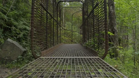 Walking through waterfall viewing platform cage. Stock Footage 112607820
