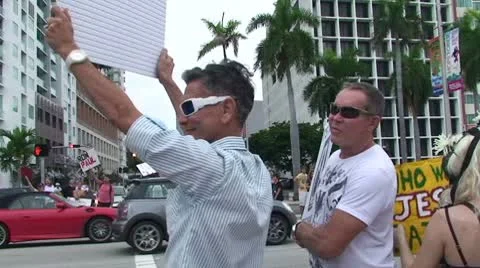 Walking Thru Protesters Stock Footage 8853044