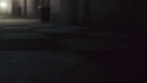 Walking on a tile floor in a dimly lit hallway during evening hours Stock Footage 345004241