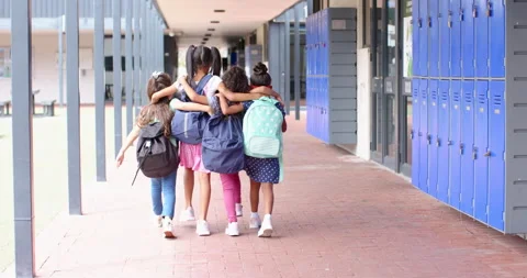 Walking together, group of school children with backpacks in school hallway Stock Footage 300327329