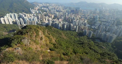 Walking at top and look down to Lion Tail ridge and Kowloon cityscape Stock Footage 309437630